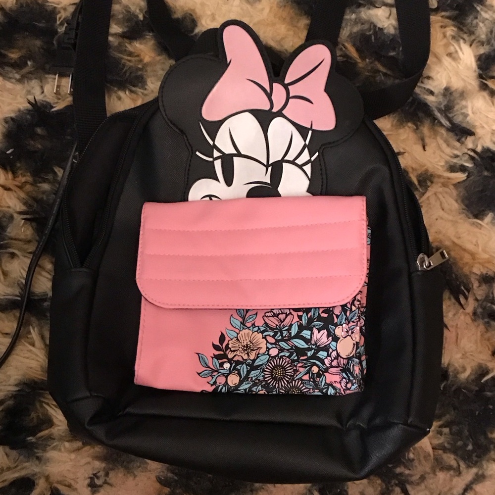 Black and pink Disney Minnie Mouse mini backpack. About 15 inches tall.